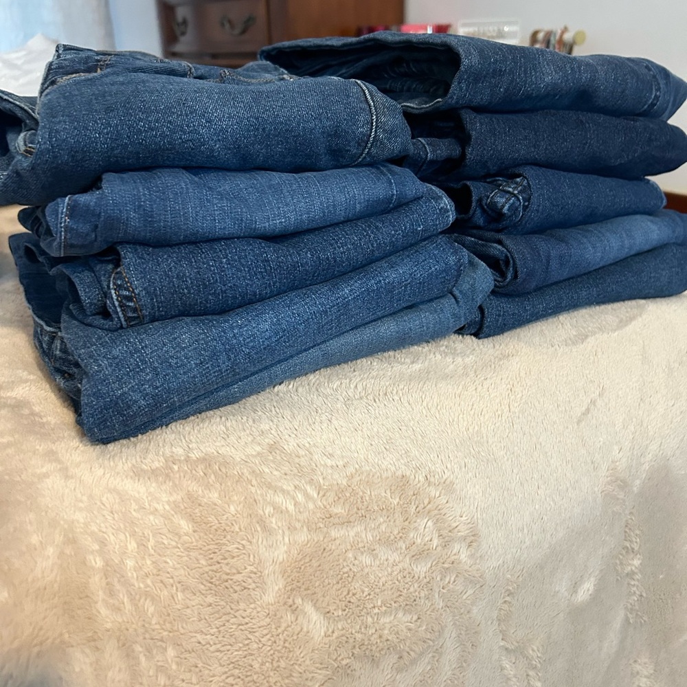 Bundle of medium to dark wash jeans